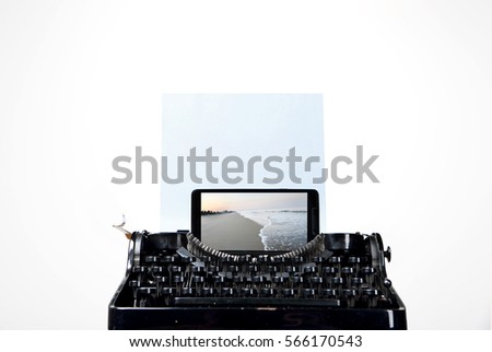 on a neutral white background shows a typewriter, a smartphone, a photo and an ocean