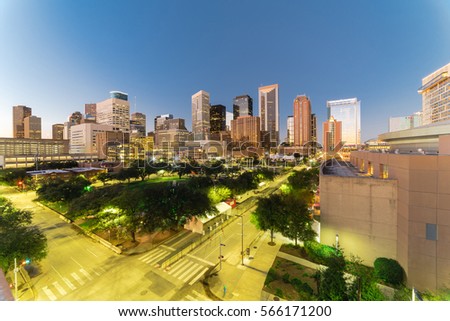 Aerial view downtown Houston illuminated at blue hour with green city park and modern skylines light. The most populous city in Texas, fourth-most in United States. Architecture and travel background.