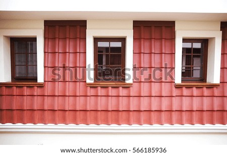 photo of attic with windows and red tile