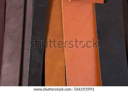 Close up of cutted leather pieces for belts. High resolution photo.