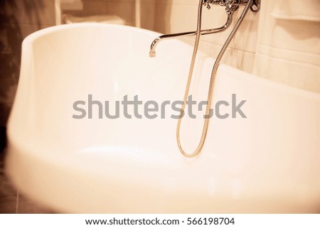 photo of bathtub faucet in the bathroom