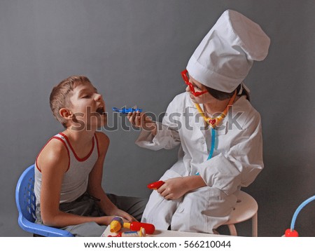 Girls Playing as Doctor and Patient with Stethoscope 