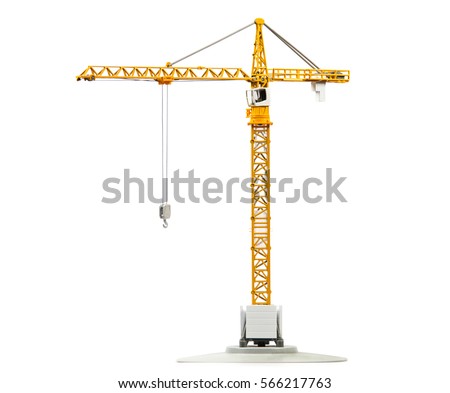 scale model of yellow tower crane isolated on white background Royalty-Free Stock Photo #566217763