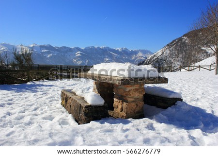 Winter, picnic table in mountain 