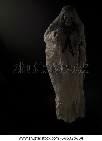 Ghostly figure floating on black background halloween themed image