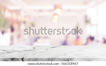 Stone table top and blurred restaurant interior background with vintage filter - can used for display or montage your products.