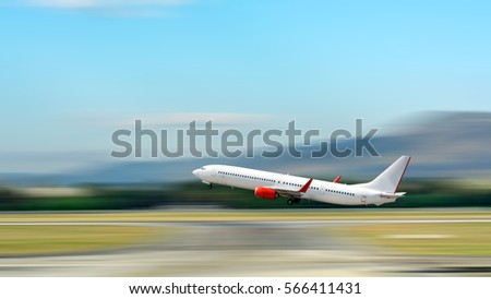 Airplane take off. Motion blur effect. Royalty-Free Stock Photo #566411431