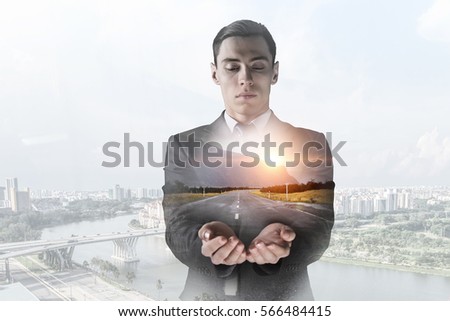 Businessman against modern city background . Mixed media