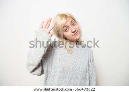 Portrait of a woman smiling and saying hello