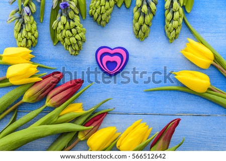 Tulips and hyacinths on a wooden table, heart, love, Valentine's Day 