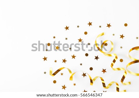 Bright confetti in shape of stars, on white background. Close up Royalty-Free Stock Photo #566546347