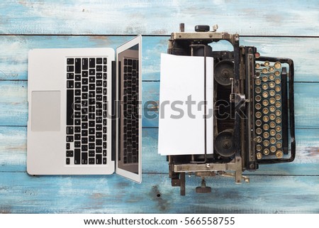Old typewriter and laptop. Concept of technology progress