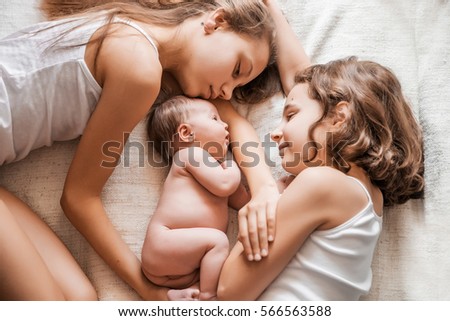 A newborn infant with the senior sisters.