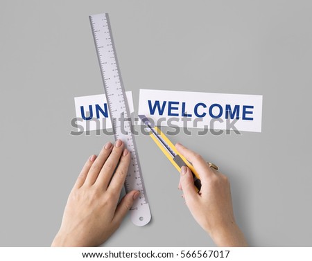 Unacceptable Unwelcome Hand Cut Word Split Concept Royalty-Free Stock Photo #566567017