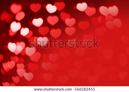 Red and white hearts bokeh as background for Valentine's day with red copy space for your text