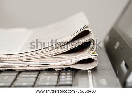 newspapers on the laptop