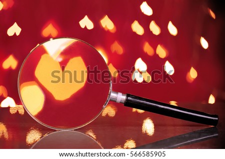 Abstract heart bokeh through magnifying glass.Concept of love, Valentine, soul mate, destiny.