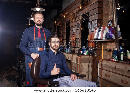 man in Barbershop, haircut and shave men in the cabin, client and Barber