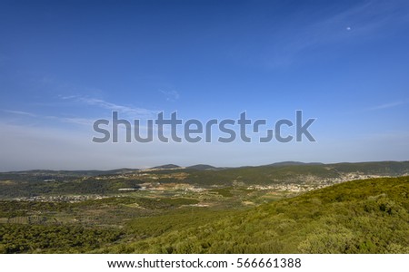 israeli landscape with blue sky Royalty-Free Stock Photo #566661388