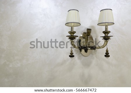 Vintage lamp on the decorated wall