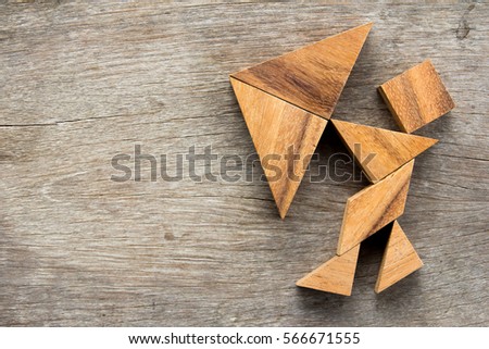 Tangram puzzle in man hold umbrella (Concept for business about face the crisis or problem)