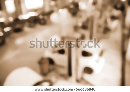 Blurred  background abstract and can be illustration to article of Serviceman checking in a car at garage