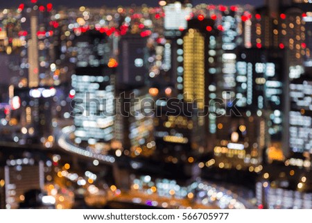 Night blurred Osaka business downtown aerial view, Japan, abstract background