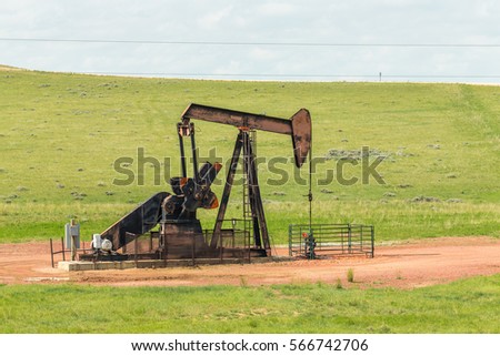 Located in a field this pumpjack endlessly pulls fuel from the earth