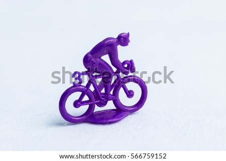 Plastic figure of cyclist . Plastic cyclists isolated on white background