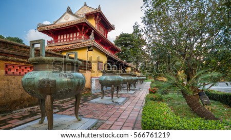 Pavilion and urns in the Imperial City of Hue, Vietnam Royalty-Free Stock Photo #566761219