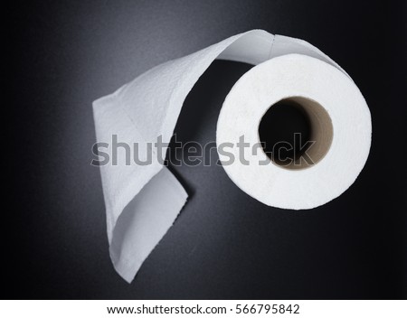 white tissue roll on black background.