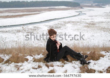 girl in a winter coat on a background of beautiful scenery