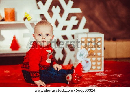 Cute little boy laughing in  New Year  studio