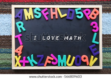 Blackboard with colorful alphabet and text i love math.