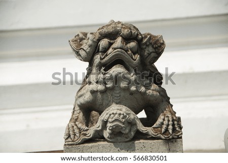 Stone statue in the ancient Wat Pho Temple. Bangkok, Thailand