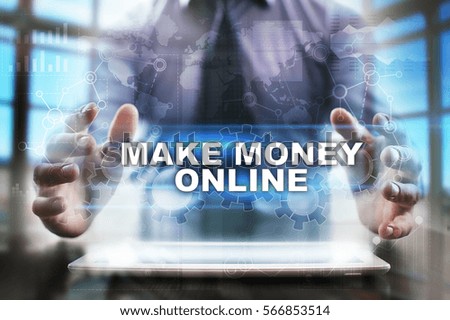 Businessman using tablet pc and selecting make money online.