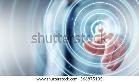 Businessman on blurred background pushing  power button with his finger Royalty-Free Stock Photo #566875105