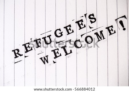 refugees welcome text on white line paper