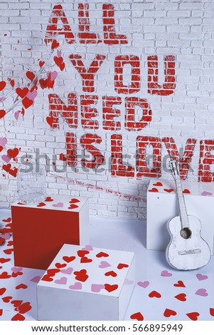 all you need - this is love - the inscription on the brick wall Valentine's Day