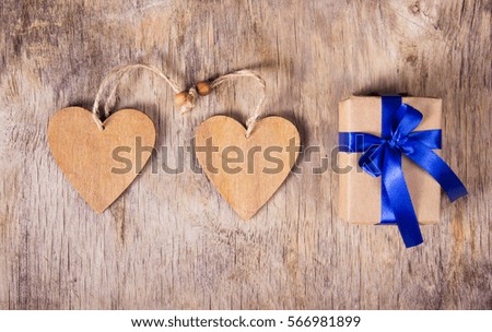 Gift box made of recycled paper and wood Valentine. Surprise on Valentine's Day. Two valentine. Copy space