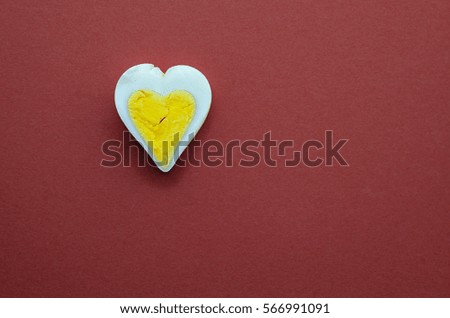 Egg heart on red background. Romantic background concept