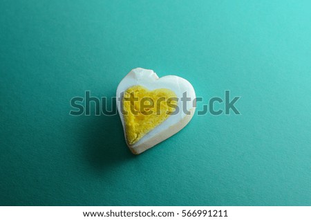 Egg heart on Turquoise color background. Romantic sign background concept