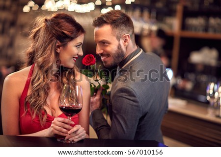 Man give rose to girlfriend in the Valentine's evening  Royalty-Free Stock Photo #567010156