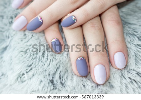 Serenity manicure with diamonds. Shaggy background