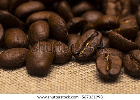 The Coffee beans on vintage linen background