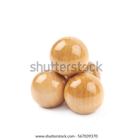Pile of wooden spheres isolated over the white background