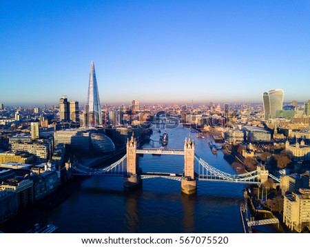 Aerial view over Tower Bridge, River Thames and the city of London, UK