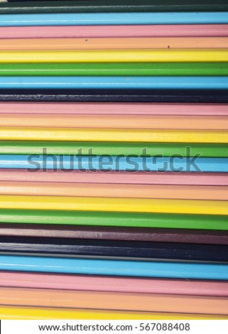 Rainbow pencil texture wallpaper background. Rainbow concepts. Studio photo with colorful pencils. Yellow, orange pink red green blue colors.