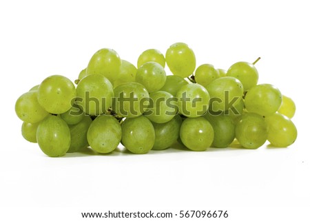 Healthy fruits Green wine grapes with isolated white background. Unwashed big wine green grapes on white background. Green grapes from a supermarket local market. Bunch of grapes ready to eat