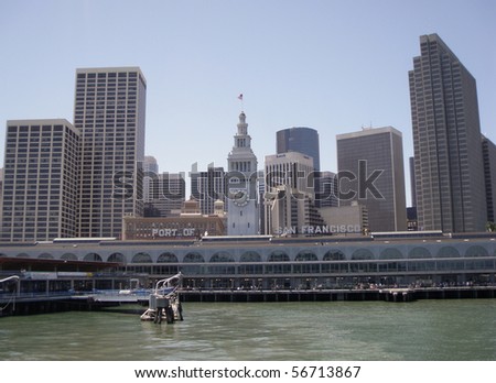Port of San Francisco Ferry building and cityscape of Downtown San Francisco in the background.  Taken from a ferry departing
